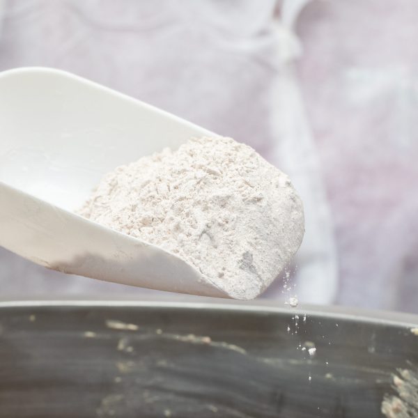 Adding flour into frying metallic pan. High quality photo