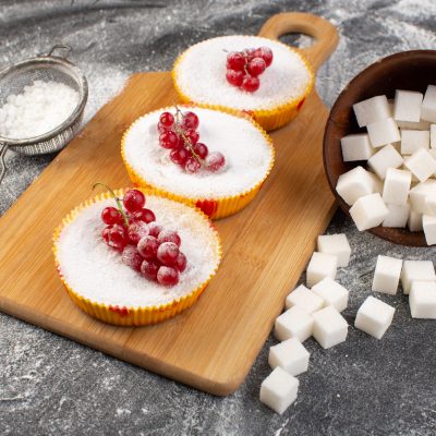 front-close-view-delicious-cranberry-cakes-with-red-cranberries-top